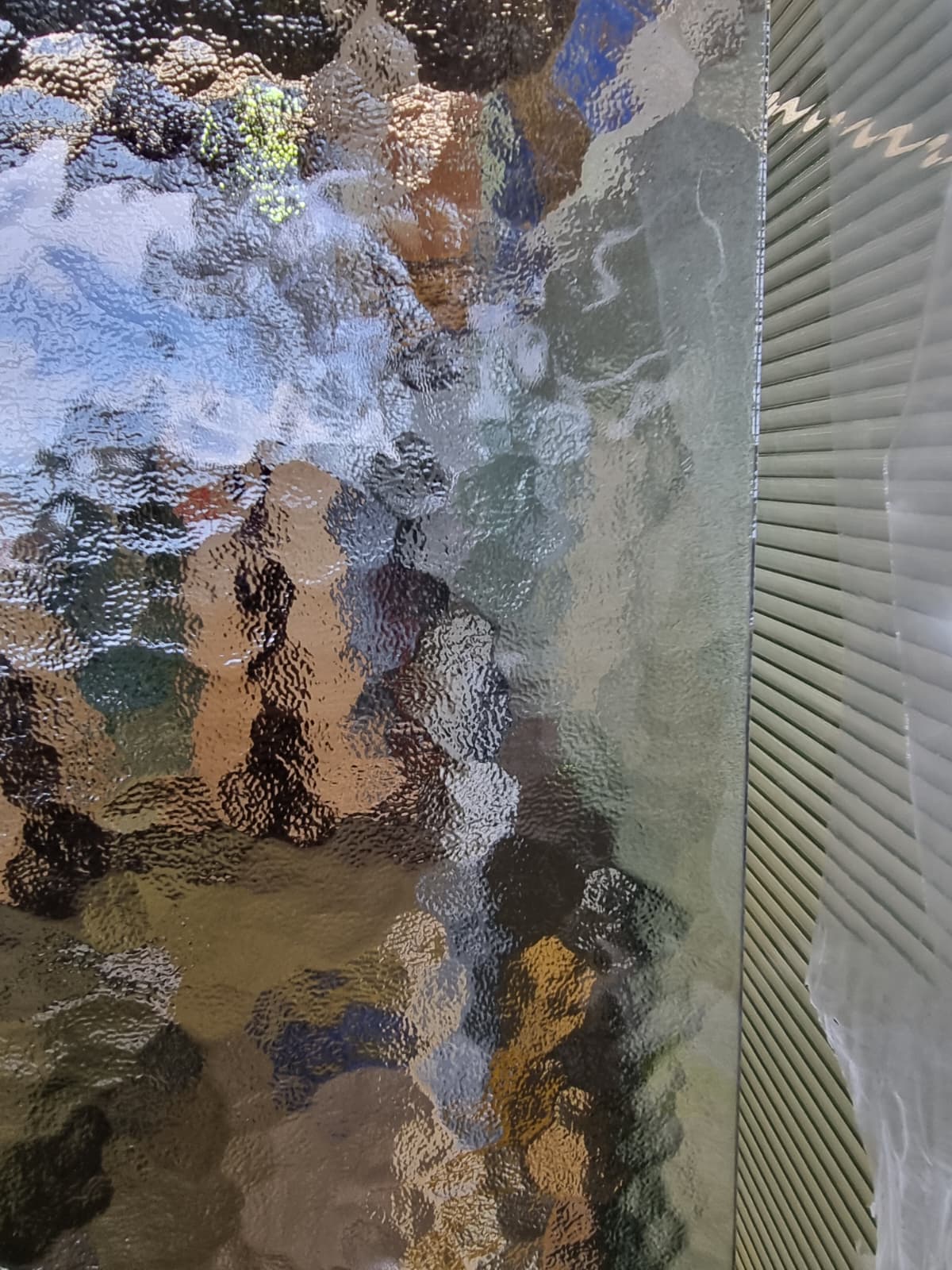 Textured frosted glass panel for privacy screening with stylish decorative finish