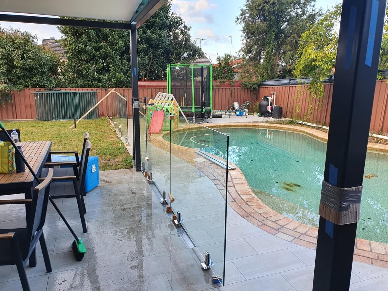 Elegant glass pool fence installation providing safety and unobstructed views